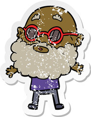 distressed sticker of a cartoon curious man with beard and sunglasses
