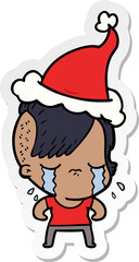 hand drawn sticker cartoon of a crying girl wearing santa hat