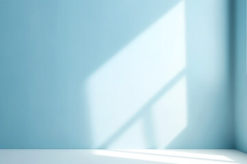 Empty light blue room with sunlight falling through window