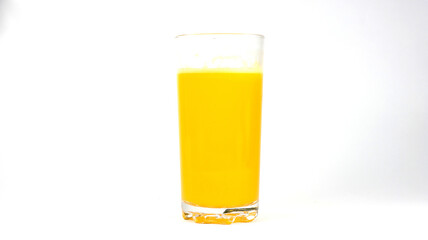 closeup of a glass of orange juice on white background