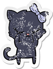 distressed sticker of a cute cartoon cat with bow