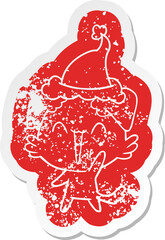 happy little dog quirky cartoon distressed sticker of a wearing santa hat