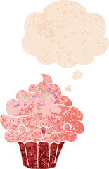 cute cartoon frosted cupcake with thought bubble in grunge distressed retro textured style