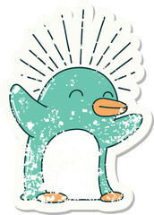 worn old sticker of a tattoo style happy penguin