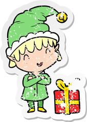 distressed sticker of a cartoon happy christmas elf
