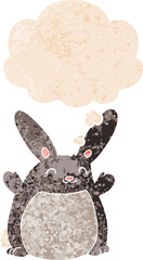 cartoon rabbit with thought bubble in grunge distressed retro textured style