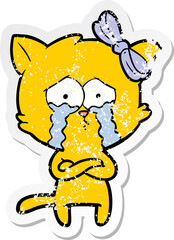 distressed sticker of a cartoon cat