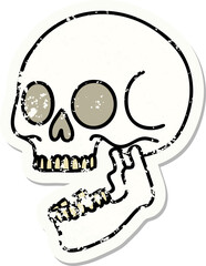 distressed sticker tattoo in traditional style of a skull