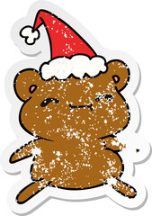 hand drawn christmas distressed sticker cartoon of kawaii bear