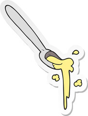 sticker of a cartoon spoonful