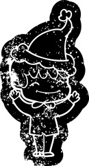 quirky cartoon distressed icon of a happy boy wearing santa hat