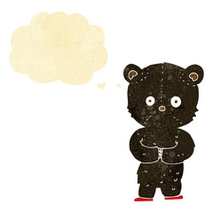 cartoon teddy black bear cub with thought bubble