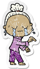 distressed sticker of a cartoon crying old lady