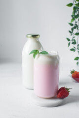 Pink latte with whipped cream in a can shaped glass, strawberry raspberry latte in a glass shaped like a can, Aesthetic cafe pink latte in a can glass