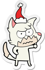 Fototapeta premium hand drawn sticker cartoon of a annoyed fox wearing santa hat