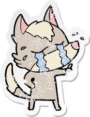 distressed sticker of a cartoon crying wolf