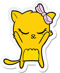 sticker of a cute cartoon cat with bow