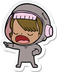 sticker of a cartoon talking astronaut