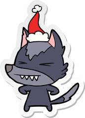 angry wolf hand drawn sticker cartoon of a wearing santa hat