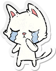 distressed sticker of a crying cartoon cat