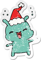 hand drawn christmas distressed sticker cartoon of kawaii alien