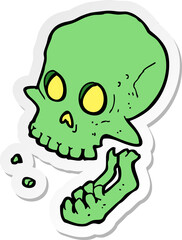 sticker of a cartoon laughing skull