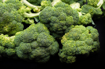Broccoli in a pile on a market. Broccoli in a pile on a farm stand.