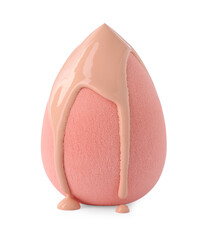 Makeup sponge with skin foundation isolated on white