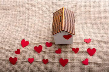 Love concept with paper shaped heart and house