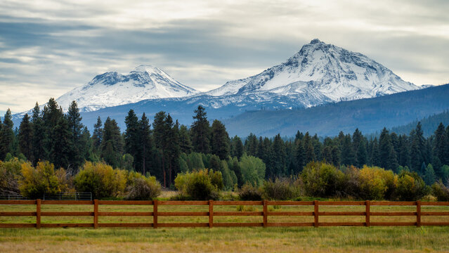 The Snowcapped Sisters Mountains in the The Cascades Mountain Range in Central Oregon During Fall Autumn