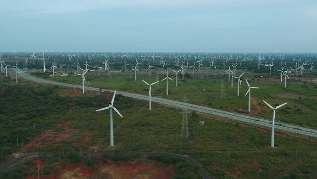 Beautiful view of Windmills or Wind Turbines farm in Nagercoil at Kanyakumari , South India_ and highwayroad