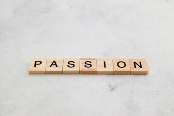 Top view of Passion word on wooden cube letter block on white background. Business concept