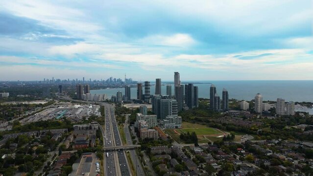 Explore South Etobicoke, Toronto, with captivating drone views from the Park Lawn area. Witness the scenic Gardiner Expressway and stunning vistas of downtown Toronto in this mesmerizing aerial perspe