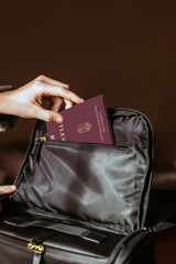 hungary pasport . Person Putting a Passport on Bag