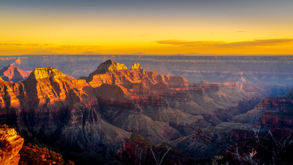Sunset over the peaks of the Grand Canyon viewed from the terrace of the Lodge on the North Rim of Grand Canyon National Park, Arizona, United States