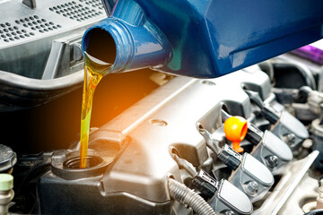 Refueling and pouring oil quality into the engine motor car Transmission and Maintenance Gear...