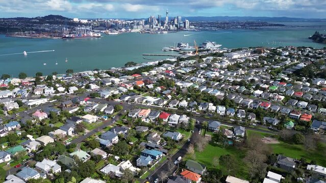 Auckland, New Zealand: Aerial drone footage of Auckland CBD skyline view from the Davenport fancy residential neighborhood in New Zealand largest city. 