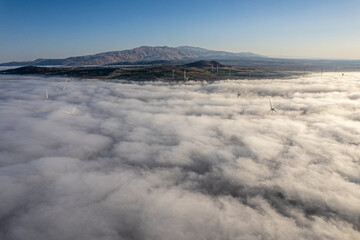aerial view of mountain above clouds