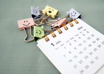 January 2024 - Closeup of a small desktop calendar with cute paperclips, time and business concept