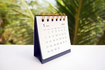 January 2024 - A small desktop calendar January 2024 with nature background, time and business...