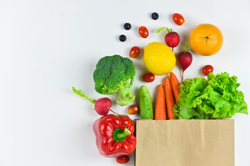 Healthy food background, healthy vegetarian food in paper bags, fruits and vegetables, banner copy...