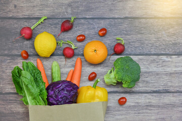 Healthy food background, healthy vegetarian food in paper bags, fruits and vegetables, banner copy...