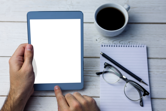 Digital png photo of hands holding tablet with copy space on wooden desk on transparent background