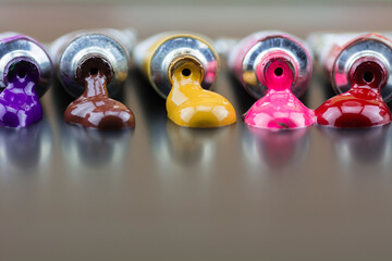 Poster paint tube  spilled on the floor.