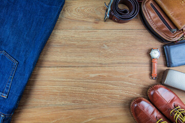 Leather for men on wooden background./ Flat lay leather for men./ Leather and jeans for men.