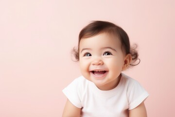 Close-up portrait of Cute little girl child happy on pastel background with copyspace area.