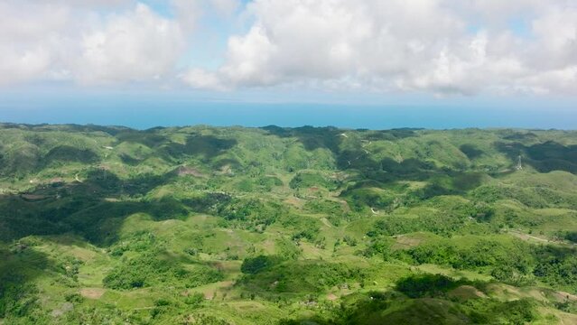 Aerial view of agricultural land among hills and mountains in a mountainous province. Libo hills. Cebu island, Philippines.