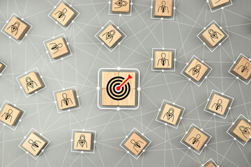 Wooden cube with person and target icon which link connection network for organisation structure...