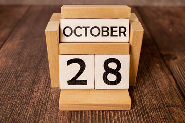 October 28th. Image of October 28 wooden color calendar on white background. Autumn day. Empty space for text