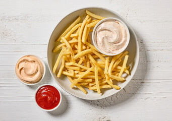 french fries with various dip sauces